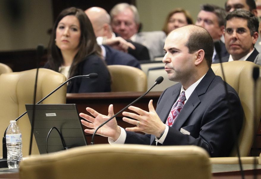Matthew Miller, assistant director of the legal division at the Bureau of Legislative Research, speaks to legislators Tuesday, Jan. 30, 2018, in Little Rock, Ark., about a recent state Supreme Court decision restricting lawsuits against the state. Some are concerned the ruling could increase demands on the state Claims Commission, which considers financial claims against Arkansas. (AP Photo/Kelly P. Kissel)