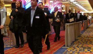 Applicants for jobs at the soon-to-open Hard Rock casino in Atlantic City N.J. line up for interviews on Tuesday, Jan. 30, 2018, at a hotel nearby. Tuesday&#39;s event was for former workers at the Trump Taj Mahal, which closed in 2016 but will reopen this summer as a Hard Rock casino resort. The former Revel casino is reopening around the same time as well as the Ocean Resort casino, adding thousands of jobs to a market that lost 11,000 since 2014 due to casino closings. (AP Photo/Wayne Parry)
