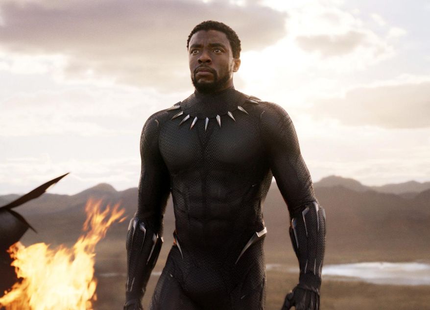 This image released by Disney and Marvel Studios' shows Chadwick Boseman in a scene from "Black Panther," in theaters on Feb. 16, 2018. As people gear up for the “Black Panther” movie, acclaimed author Ta-Nehisi Coates wants them to check out the original source, Marvel’s Black Panther comic book, where he’s booting up a massive outer space adventure for the king of Wakanda. (Marvel Studios/Disney via AP)