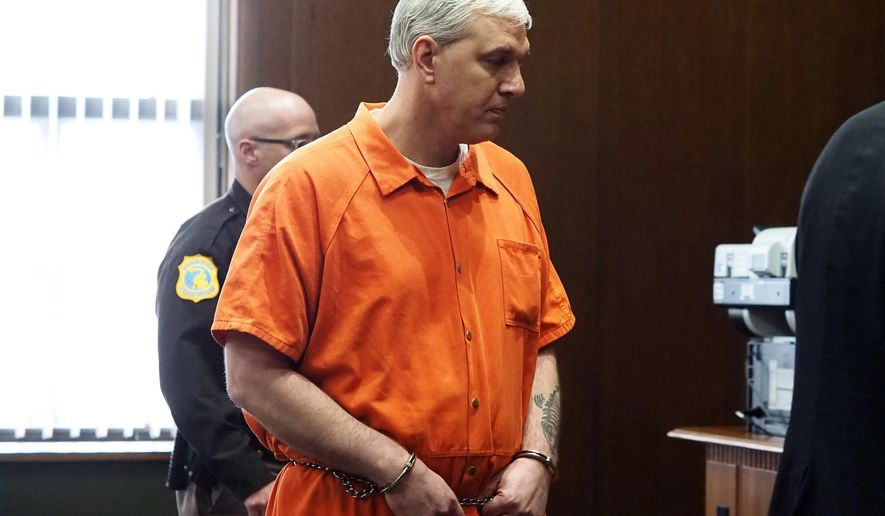 In this Monday, Jan. 29, 2018 photo, Todd Maneke, who pleaded guilty to killing his neighbor Alfred Minka in 2013, walks in a Kalamazoo, Mich., courtroom. He was sentenced to 15-20 years in prison. (Mark Bugnaski/Kalamazoo Gazette-MLive Media Group via AP)