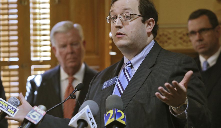 FILE - In a Jan. 28, 2015 file photo, Sen. Josh McKoon speaks out in favor of a religious freedom bill during a news conference, in Atlanta. GOP Sen. McKoon’s proposal to amend the state Constitution to make English the official language was approved by a Senate committee and is now awaiting debate on the Senate floor. Democrats have already been part of two news conferences to denounce the bill, which they call xenophobic and a “distraction” designed to drive conservative voters to the polls in November. (AP Photo/Atlanta Journal-Constitution, Bob Andres, File)