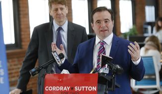 Cincinnati Mayor John Cranley, right, endorses Gubernatorial candidate Richard Cordray, left, during a news conference, Tuesday, Jan. 30, 2018, in Cincinnati. Cranley says local governments have been hurt by Republican control of Ohio’s Statehouse and that Cordray will work with cities.   (AP Photo/John Minchillo)