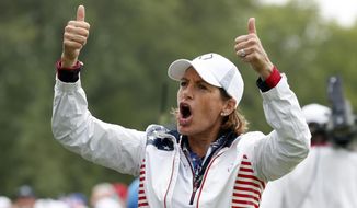 FILE - In this Aug. 19, 2017, file photo, United States captain Juli Inkster gestures to the gallery during a foursomes match in the Solheim Cup golf tournament, Saturday, Aug. 19, 2017, in West Des Moines, Iowa. Inkster is the first American to be Solheim Cup captain three times. Now she&#x27;d like the distinction of being the first American captain with three victories. (AP Photo/Charlie Neibergall, File)