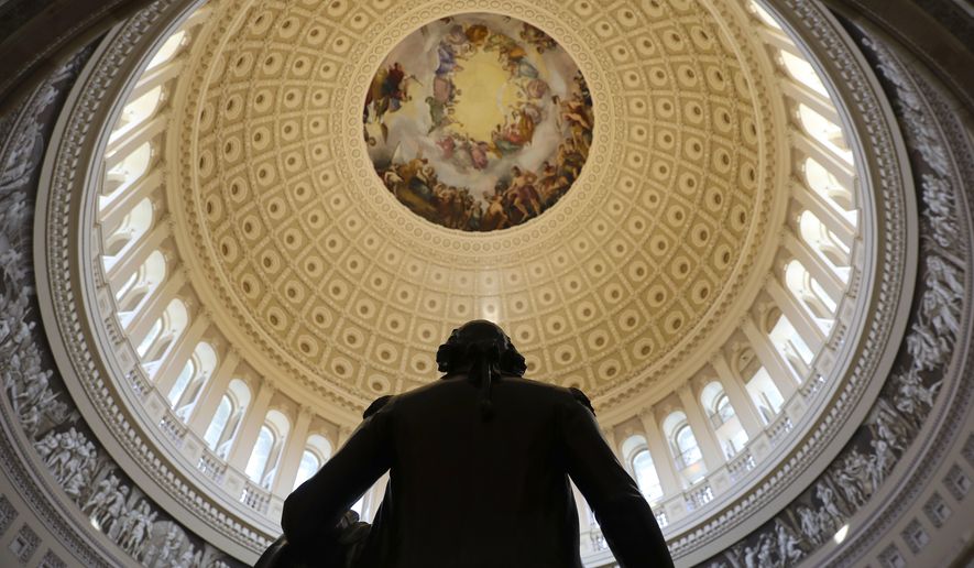 The Capitol Rotunda is seen with the statue of George Washington on Capitol Hill in Washington, Tuesday, Jan. 30, 2018, ahead of the State of the Union address by President Donald Trump. (AP Photo/Pablo Martinez Monsivais)