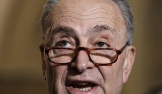 Senate Minority Leader Chuck Schumer, D-N.Y., speaks to reporters ahead of President Donald Trump&#39;s first State of the Union address, at the Capitol in Washington, Tuesday, Jan. 30, 2018. Schumer said Trump should thank his predecessor, Barack Obama, for the booming economy during the address. (AP Photo/J. Scott Applewhite)