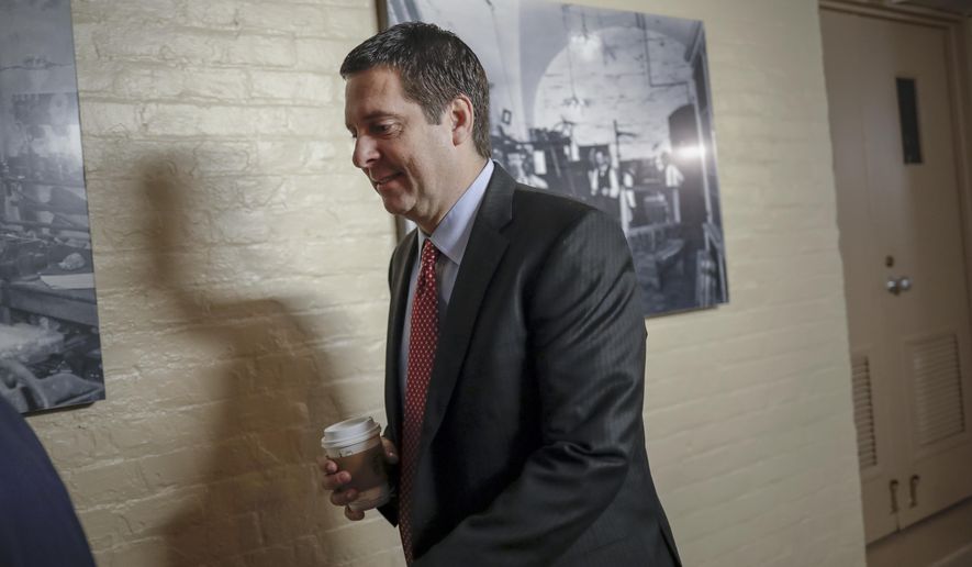House Intelligence Committee Chairman Devin Nunes, R-Calif., a close ally of President Donald Trump who has become a fierce critic of the FBI and the Justice Department, strides to a GOP conference at the Capitol in Washington, Tuesday, Jan. 30, 2018. House Speaker Paul Ryan is defending a vote by Republicans on the House intelligence committee to release a classified memo on the Russia investigation. (AP Photo/J. Scott Applewhite)