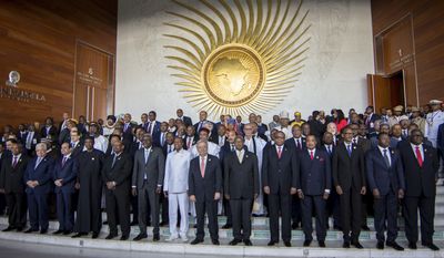Heads of state pose for a group photograph during the opening ceremony of the African Union summit in Addis Ababa, Ethiopia, Sunday, Jan. 28, 2018. The leaders of the United Nations and the African Union urged stronger international cooperation Sunday of the African Union nations. (AP Photo/Mulugeta Ayene)