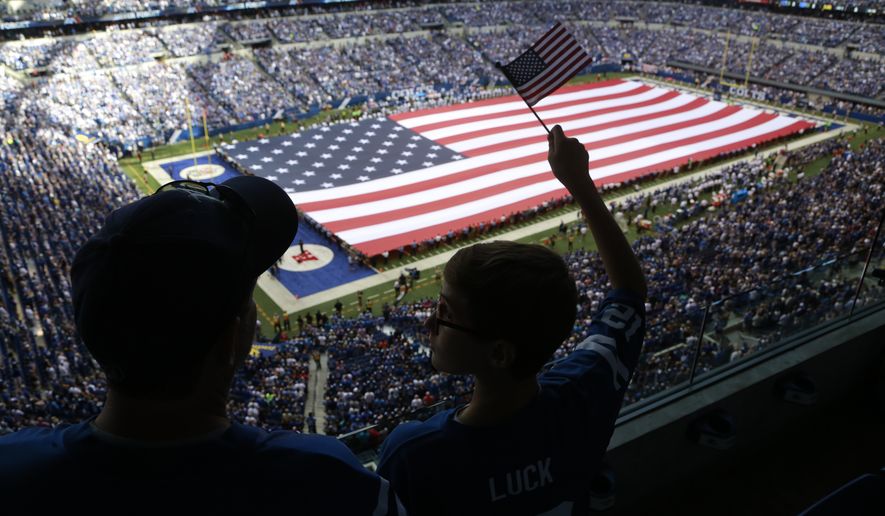 The American Flag is displayed during the National Anthem before an NFL football game between the Indianapolis Colts and the Detroit Lions in Indianapolis, Sunday, Sept. 11, 2016. (AP Photo/R Brent Smith)