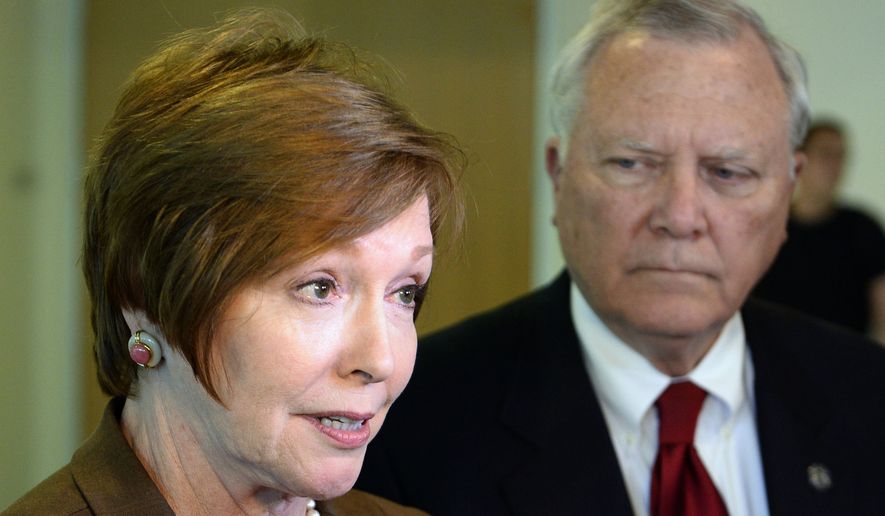 In this Oct. 16, 2014 file photo, Brenda Fitzgerald, Georgia Department of Public Health commissioner, left, and Georgia Gov. Nathan Deal respond to questions in Atlanta. U.S. officials announced that Fitzgerald, the director of the nation’s top public health agency has resigned because of financial conflicts of interest. On Tuesday, Jan. 30, 2018, the U.S. Department of Health and Human Services officials said Fitzgerald’s complex financial interests had caused conflicts of interest that made it difficult to do her job. Alex Azar, who was sworn in as head of the department Monday, accepted her resignation. (AP Photo/David Tulis, File)