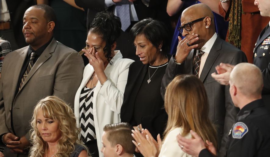 From top left, Robert Mickens, Elizabeth Alvarado, Evelyn Rodriguez, Freddy Cuevas, parents of two Long Island teenagers who were believed to have been killed by MS-13 gang members, during the State of the Union address to a joint session of Congress on Capitol Hill in Washington, Tuesday, Jan. 30, 2018. (AP Photo/Pablo Martinez Monsivais) ** FILE **