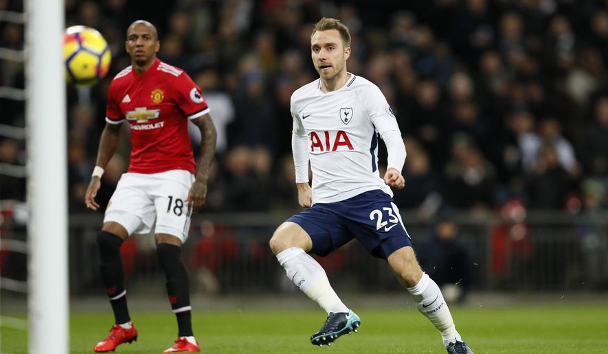 Tottenham&#39;s Christian Eriksen, right, scores the opening goal during the English Premier League soccer match between Tottenham Hotspur and Manchester United at Wembley stadium in London, England, Wednesday, Jan. 31, 2018. (AP Photo/Kirsty Wigglesworth)
