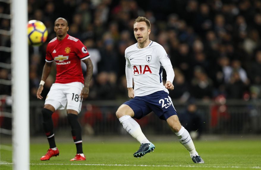 Tottenham&#x27;s Christian Eriksen, right, scores the opening goal during the English Premier League soccer match between Tottenham Hotspur and Manchester United at Wembley stadium in London, England, Wednesday, Jan. 31, 2018. (AP Photo/Kirsty Wigglesworth)
