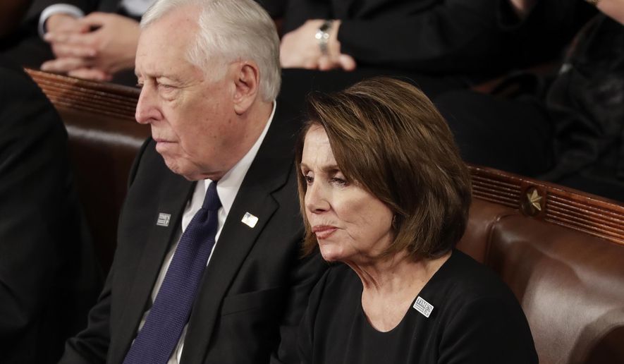 House Minority Leader Nancy Pelosi of California and Minority Whip Steny Hoyer, D-Md., listen to the State of the Union address to a joint session of Congress on Capitol Hill in Washington, Tuesday, Jan. 30, 2018. (AP Photo/J. Scott Applewhite)