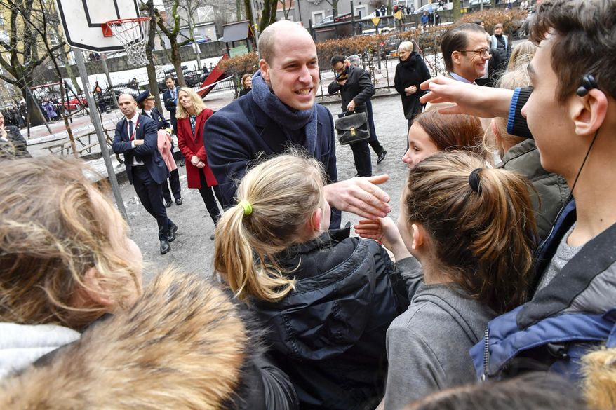 Britain's Prince William is greeted by pupils at Matteus School in Stockholm, Sweden, Wednesday Jan. 31, 2018. Prince William and Kate Duchess of Cambridge are on a four-day visit to Sweden and Norway. (Jonas Ekströmer / TT via AP)