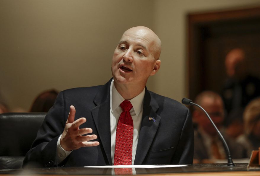 Neb. Gov. Pete Ricketts presents his property and income tax plan to the Revenue Committee in Lincoln, Neb., Wednesday, Jan. 31, 2018. Gov. Ricketts' plan faces several competing measures and skepticism from some lawmakers over its long-term impact on the state budget. (AP Photo/Nati Harnik)