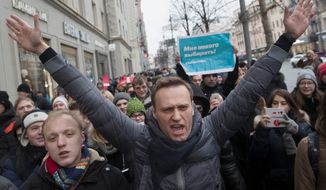 Russian opposition leader Alexei Navalny, centre, attends a rally in Moscow, Russia, Sunday, Jan. 28, 2018. Russian opposition leader Alexei Navalny has been arrested in Moscow as protests take place across the country. (AP Photo/Evgeny Feldman)