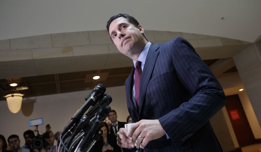 In this photo taken Wednesday, March 22, 2017, House Intelligence Committee Chairman Devin Nunes, R-Calif., gives reporters an update about the ongoing Russia investigation adding that President Donald Trump's campaign communications may have been "monitored" during the transition period as part of an "incidental collection," on Capitol Hill in Washington. (AP Photo/J. Scott Applewhite) ** FILE **