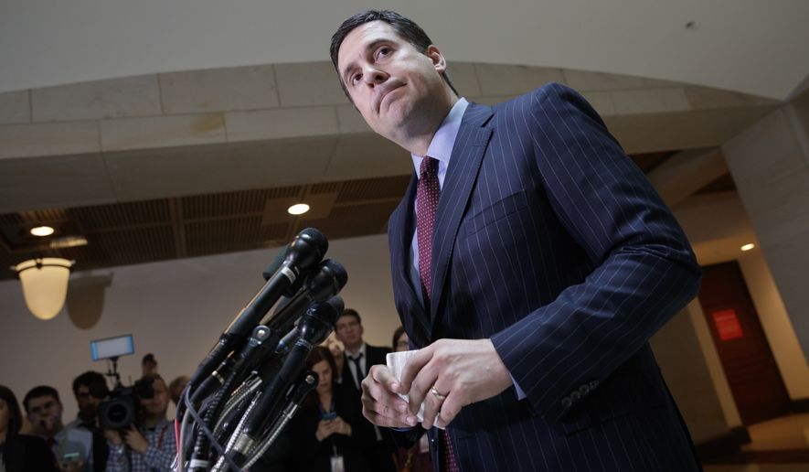 In this photo taken Wednesday, March 22, 2017, House Intelligence Committee Chairman Devin Nunes, R-Calif., gives reporters an update about the ongoing Russia investigation adding that President Donald Trump&#x27;s campaign communications may have been &quot;monitored&quot; during the transition period as part of an &quot;incidental collection,&quot; on Capitol Hill in Washington. (AP Photo/J. Scott Applewhite) ** FILE **