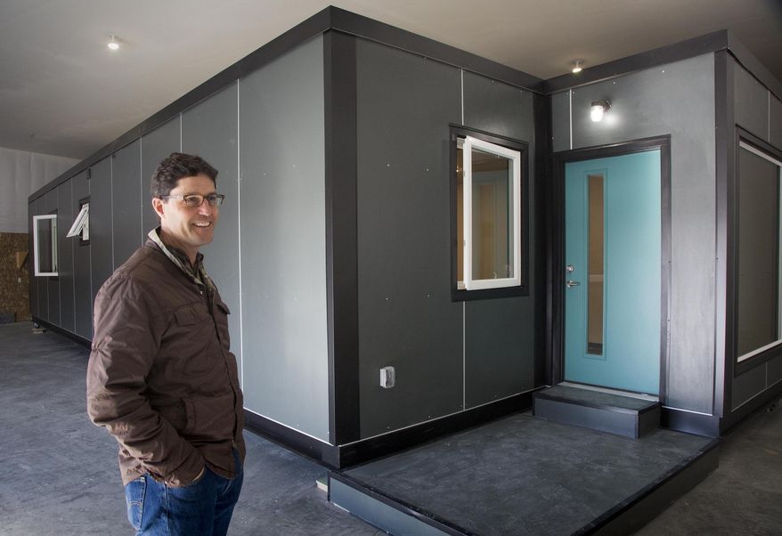 In this Jan. 25, 2018, photo, Scott Flynn, founder and CEO of IndieDwell, shows the model home at his manufacturing facility in Boise, Idaho. He said many of the energy efficient materials he used to convert this storage container home are the same he uses to build high-end custom homes. (Darin Oswald/Idaho Statesman via AP)