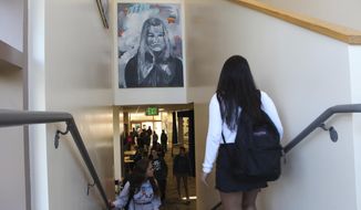 In this Tuesday, Jan. 30, 2018 photo provided by Sophia Muys, students pass under one of James Franco&#39;s paintings displayed above a stairwell in the Media Arts Center at Palo Alto High School in Palo Alto, Calif. Actor and director Franco is a 1996 graduate of the school. Franco&#39;s former high school has taken down a mural he painted and plans to remove other art donated by the celebrity alumnus who is facing allegations of sexual misconduct in Hollywood. A statement from the school district Thursday, Feb. 1, 2018, said removing the artwork was &amp;quot;in the best interests of our students.&amp;quot;  (Sophia Muys/Paly Voice via AP)