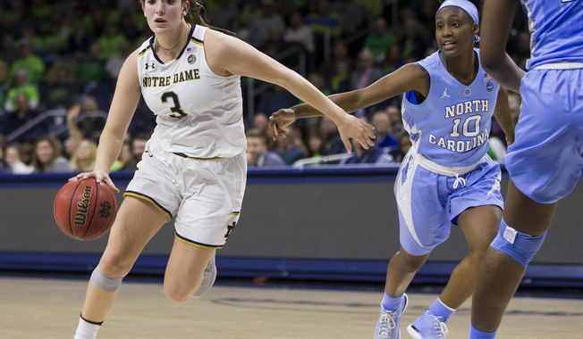 Notre Dame's Marina Mabrey (3) drives next to North Carolina's Jamie Cherry (10) during the first half of an NCAA college basketball game Thursday, Feb. 1, 2018, in South Bend, Ind. (AP Photo/Robert Franklin)