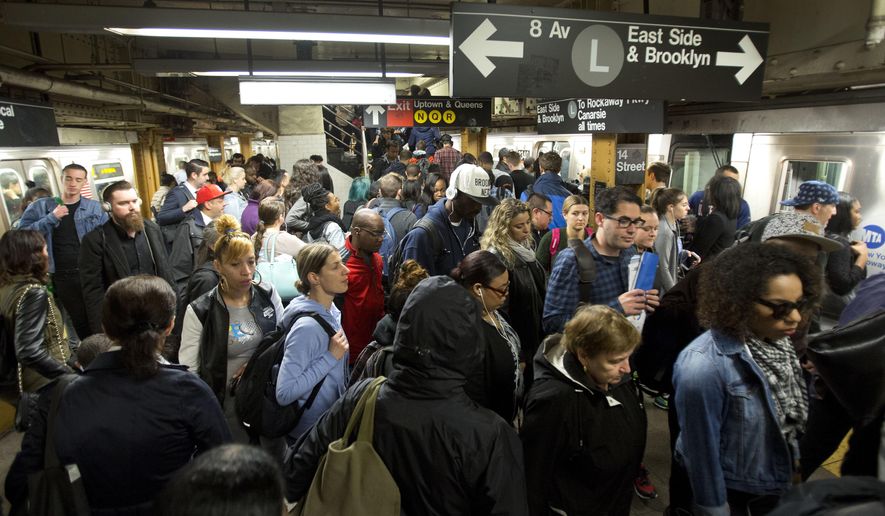 FILE- In this May 24, 2016, file photo, L train commuters work their way across a crowded subway platform in New York.Republican President Donald Trump has called for a new $1.5 trillion infrastructure program, but it's unclear how much, if any of the money would go to two of New York's most pressing transportation needs. New York City's beleaguered subway system needs billions of dollars in upgrades, while long-awaited plans for a new Hudson River rail tunnel will require at least $13 billion. (AP Photo/Mark Lennihan)