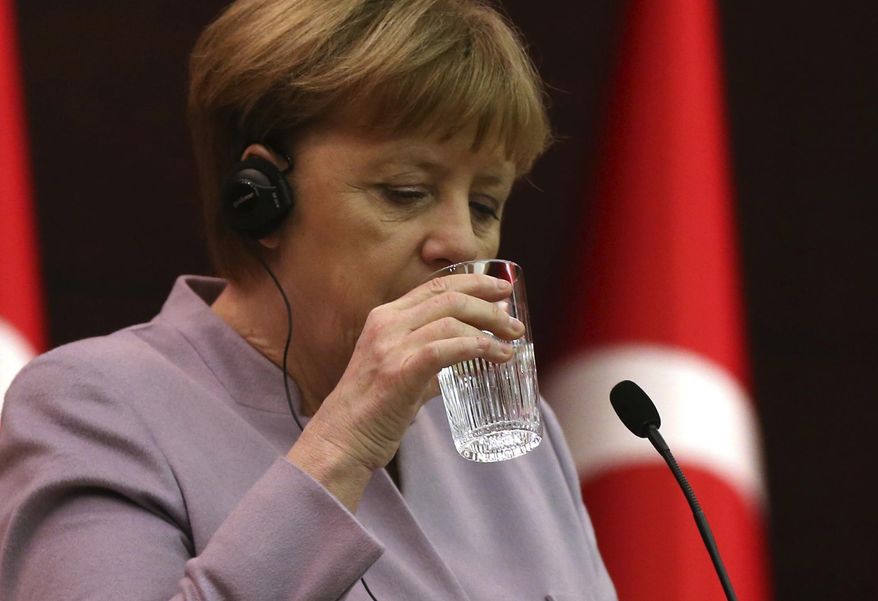 FILE - In this file photo dated Thursday, Feb. 2, 2017, German Chancellor Angela Merkel drinks water during a press conference in Ankara, Turkey. The European Union said Thursday Feb.1, 2018, the rules governing water quality will change to improve access to drinking water and limit plastic waste by discouraging people from drinking bottled water. (AP Photo/Lefteris Pitarakis, FILE)