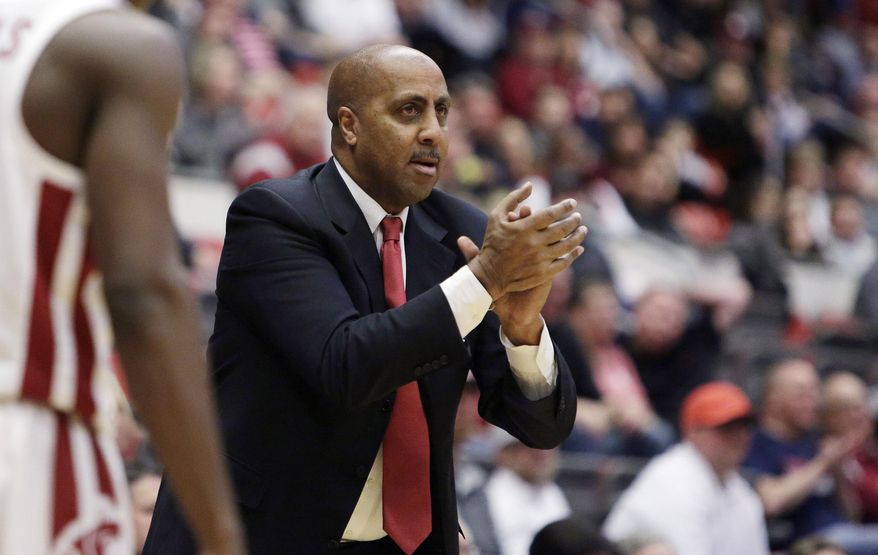 FILE - In this Wednesday, Jan. 31, 2018, file photo, Arizona associate head coach Lorenzo Romar reacts during the first half of an NCAA college basketball game against Washington State in Pullman, Wash.  Romar is uncertain about what will happen Saturday. He spent 15 seasons as the head coach at Washington, but now will walk into Huskies home gym as the opponent. Romar is now an assistant for No. 9 Arizona, which faces Washington on Saturday. (AP Photo/Young Kwak, File)