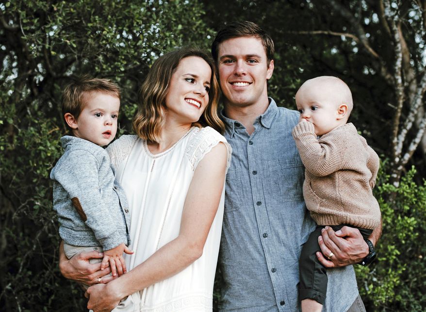 This Nov. 18, 2016 photo provided by Red Aspen Photography shows Ryan Folsom with his wife Lauren and sons Cal and Grady posing for a portrait in San Antonio, Texas. Grace Elizabeth Ward, a Northern California woman who drove her car head-on into freeway traffic in an alleged suicide attempt, has been charged with the second-degree murder of Ryan Folsom, the driver she struck, authorities said Thursday, Feb. 1, 2018. Ward, 28, suffered a broken leg in the accident that killed Folsom on Interstate 5 on Jan. 7, 2018. Folsom, 29, was from Medford, Ore., and attended medical school in San Antonio, Texas. (Ashleigh Cropper/Red Aspen Photography via AP)