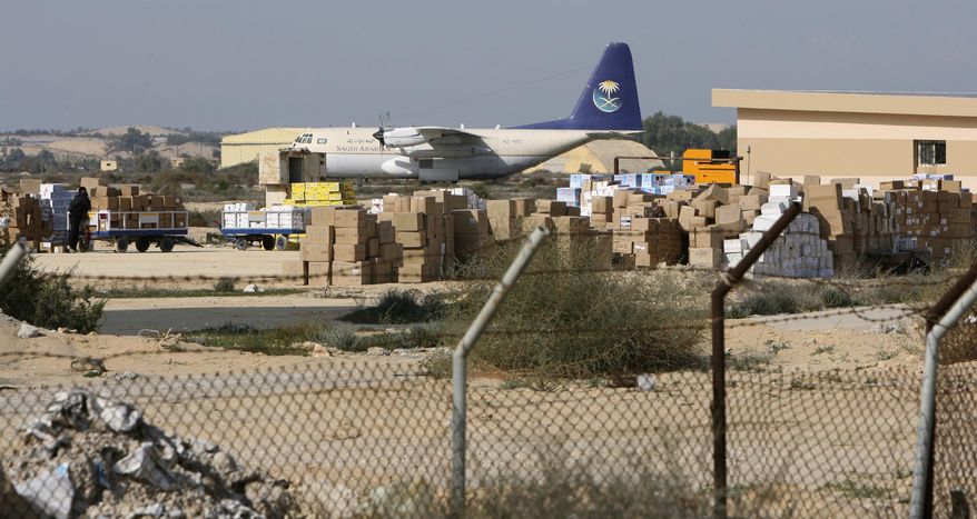 FILE - In this file photo taken o Dec. 29, 2008. nDonated medical supplies are seen at El-Arish airport waiting to be shipped to Gaza through the Egyptian border crossing terminal in Rafah, at the Sinai town of El-Arish, Egypt. The Egyptian army is bulldozing homes and olive groves in Feb. 2018 to build a buffer zone around the main airport in its troubled North Sinai Province, where Islamic State militants nearly killed the defense and interior ministers in December. The operation, described by residents and military officials, will displace thousands of residents from the hamlets around el-Arish airport, who are being moving to nearby cities where the army says they will receive compensation. (AP Photo/Nasser Nasser, File)