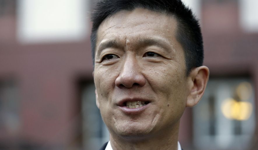 FILE - In this Dec. 6, 2017, file photo, Hawaii Attorney General Doug Chin speaks with media members in front of a federal courthouse after appearing there in Seattle. Chin, who led the state's legal opposition to the Trump administration's travel ban, will have a new job in state government. Chin announced Friday, Feb. 2, 2018, he will accept the position of lieutenant governor, replacing Shan Tsutsui, who resigned this week. (AP Photo/Elaine Thompson, File)