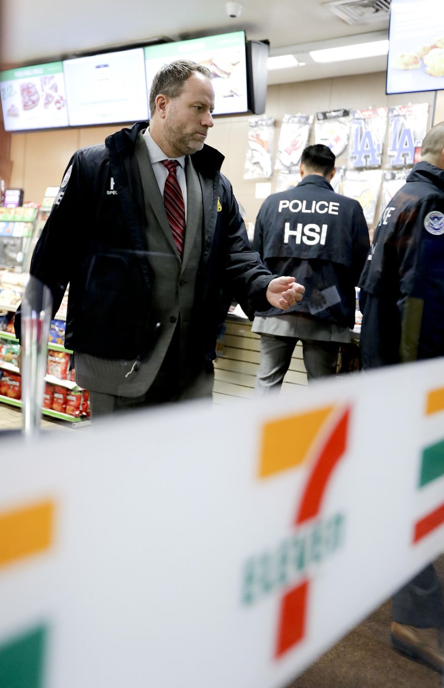 File-In this file photo from Wednesday, Jan. 10, 2018, Christopher Kuemmerle, a group supervisor for U.S. immigration and Customs Enforcement's Homeland Security Investigations unit, watches as agents serve an employment audit notice at a 7-Eleven convenience store in Los Angeles. Immigration agents this week delivered inspection notices to 77 restaurants and other businesses in Northern California and gave them three workdays to prove their employees are authorized to work in the country. ICE agents served notices Monday through Wednesday to businesses in Sacramento, San Jose and San Francisco. A notice of inspection asks business owners to produce so-called I-9 forms, which employees are required to fill when first hired to confirm they are legally authorized to work. The audits come two weeks after California Attorney General Xavier Becerra warned business owners they could face fines of up to $10,000 if they violate a new state law that bars them from turning over workers' records to federal authorities. (AP Photo/Chris Carlson, File)