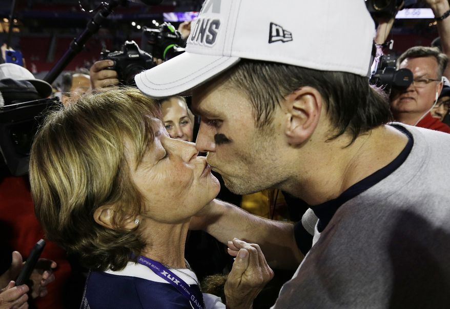 FILE - In this Feb. 1, 2015, file photo, New England Patriots quarterback Tom Brady kisses his mother, Galynn, after the NFL Super Bowl 49 football game against the Seattle Seahawks in Glendale, Ariz. (AP Photo/David J. Phillip, File)