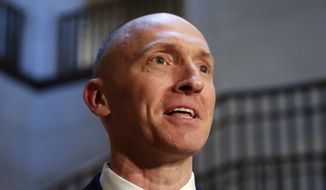 Carter Page has spent hours answering questions from FBI agents and has not been charged with any crime. (Associated Press/File)