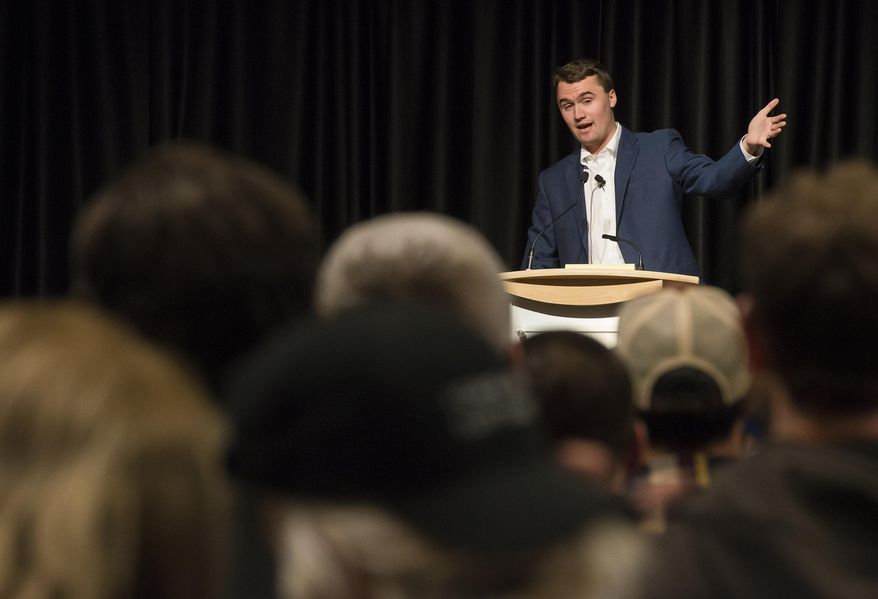 In this Friday, Feb 2, 2018, photo conservative activist Charlie Kirk, a speaker with Turning Point USA gives his speech at the Lory Student Center on campus at Colorado State University in Fort Collins, Colo. Police broke up a crowd of about 200 demonstrators at the university after a group arrived armed with bats and shields. Campus police say there were no arrests at the demonstration late Friday. (Timothy Hurst/The Coloradoan via AP)