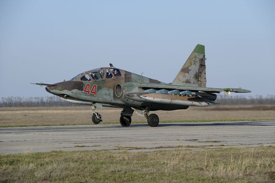Russian Su-25 ground attack jet lands after return from Syria at a Russian air base in Primorsko-Akhtarsk, southern Russia, Wednesday, March 16, 2016. More Russian planes returned from Syria on Wednesday, two days after President Vladimir Putin ordered Russian military to withdraw most of its fighting forces from Syria, signaling an end to Russia's five-and-a-half month air campaign. (AP Photo)