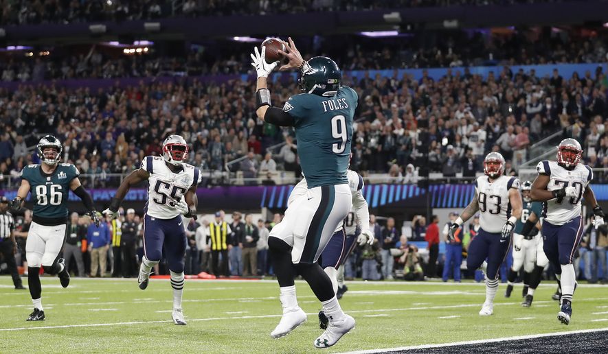 Philadelphia Eagles' Nick Foles catches a touchdown pass during the first half of the NFL Super Bowl 52 football game against the New England Patriots Sunday, Feb. 4, 2018, in Minneapolis. (AP Photo/Jeff Roberson)