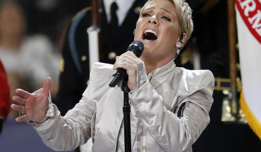 Pink performs the national anthem before the NFL Super Bowl 52 football game between the Philadelphia Eagles and the New England Patriots Sunday, Feb. 4, 2018, in Minneapolis. (AP Photo/Matt York)