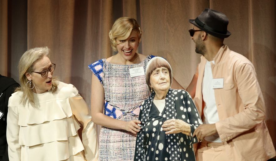Meryl Streep, from left, and Greta Gerwig react as JR, right, holds a cardboard cut-out of Agnes Varda at the 90th Academy Awards Nominees Luncheon at The Beverly Hilton hotel on Monday, Feb. 5, 2018, in Beverly Hills, Calif. (Photo by Danny Moloshok/Invision/AP)