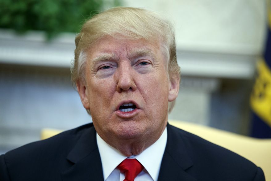 President Donald Trump speaks during a meeting with North Korean defectors where he talked with reporters about allowing the release of a secret memo on the FBI's role in the Russia inquiry, in the Oval Office of the White House, Friday, Feb. 2, 2018, in Washington. (AP Photo/Evan Vucci)