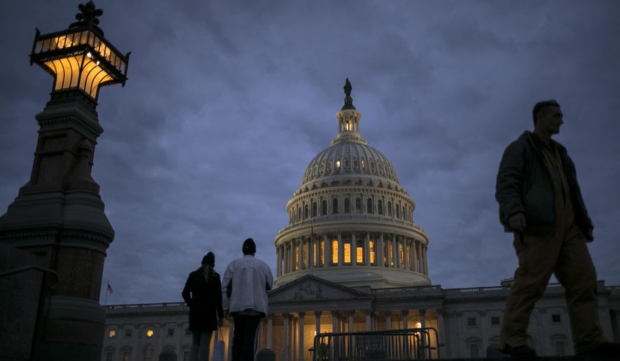 In this Jan. 21, 2018, file photo, lights illuminate the U.S. Capitol on second day of the federal shutdown as lawmakers negotiate behind closed doors in Washington. The era of trillion-dollar budget deficits is about make a comeback _ and a brewing budget deal hastened the arrival. Lawmakers are inching closer to a two-year, budget-busting spending pact that would give whopping budget increases to both the Pentagon and domestic programs have been inching closer to an agreement, according to aides and members of Congress. (AP Photo/J. Scott Applewhite, File)