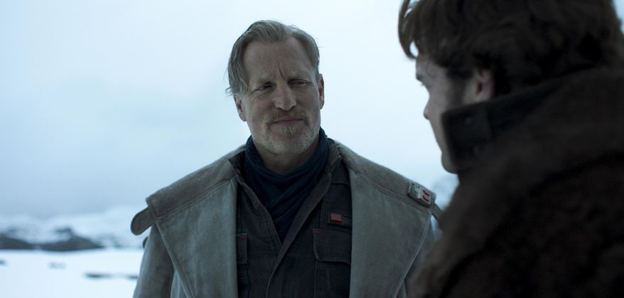 This image released by Disney shows a scene from "Solo: A Star Wars Story," starring Woody Harrelson as Beckett, left, and Alden Ehrenreich as Han Solo. The film opens in the U.S. on May 25. (Lucasfilm Ltd./Disney via AP)