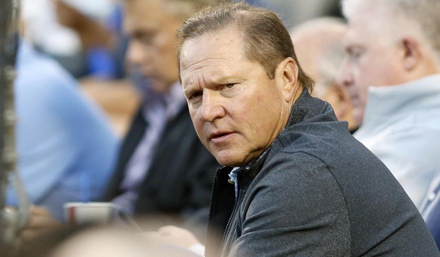 FILE - In this  Tuesday, Aug. 11, 2015, file photo, sports agent Scott Boras attends the baseball game between the Los Angeles Dodgers and Washington Nationals in Los Angeles. Agent Scott Boras says the number of major league teams rebuilding with younger, lower-cost rosters has become a cancer to the sport, attributing behavior to the strengthened luxury tax combining with restraints on draft-pick salaries. (AP Photo/Danny Moloshok, File)