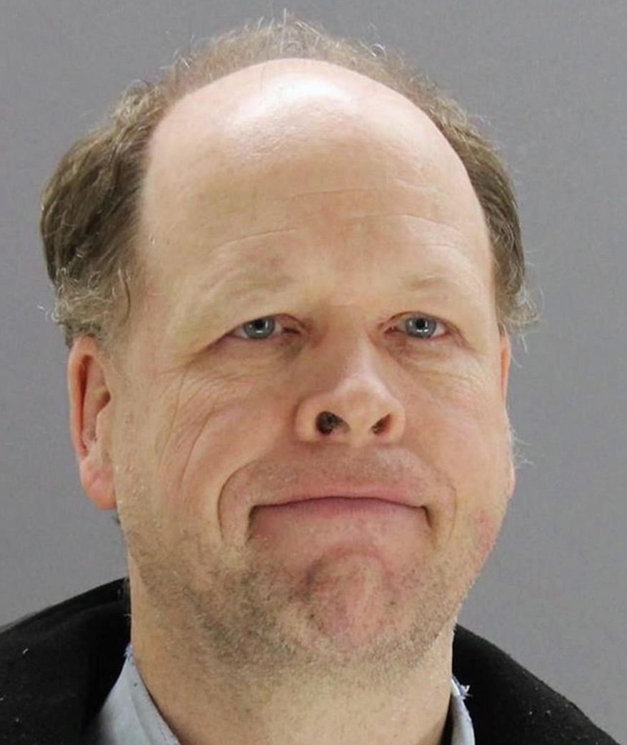 This photo provided by the Dallas County Sheriff's Department shows Gregory Simpson, of Dallas, who was arrested and charged after walking into a Dallas police substation parking lot and damaging 12 police cars with a sledgehammer on Sunday, Feb. 4, 2018. (Dallas County Sheriff's Department)