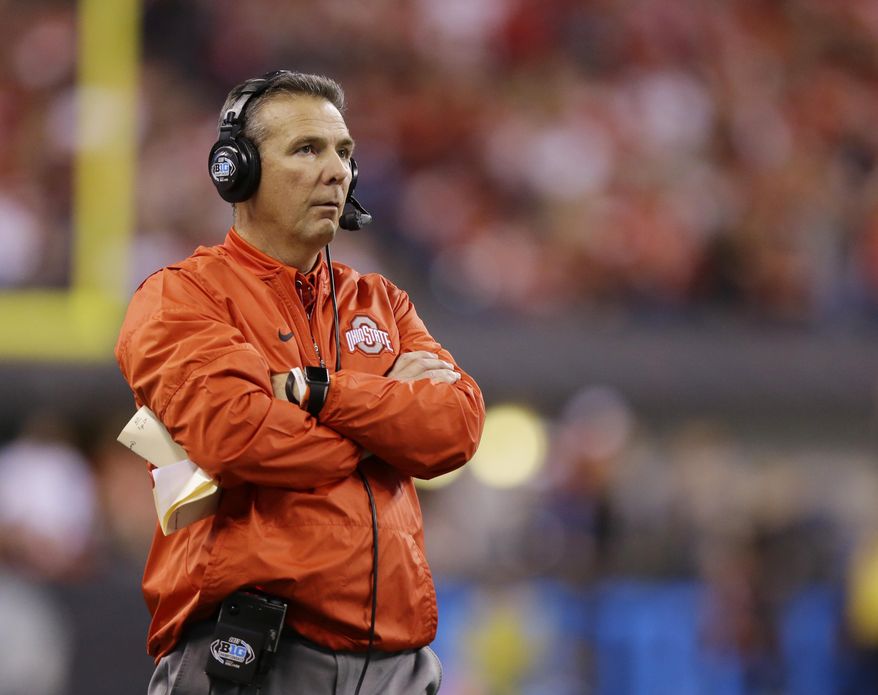 FILE - In this Dec. 2, 2017, file photo, Ohio State head coach Urban Meyer watches the first half of the Big Ten championship NCAA college football game against Wisconsin in Indianapolis. There's a strange sense of calm that has replaced the tumult typically associated with this time of year on the college football recruiting calendar. The December signing period has removed much of the suspense from the traditional national signing day that takes place the first Wednesday of February. Most of the top high school prospects already signed in December. (AP Photo/Michael Conroy, File)