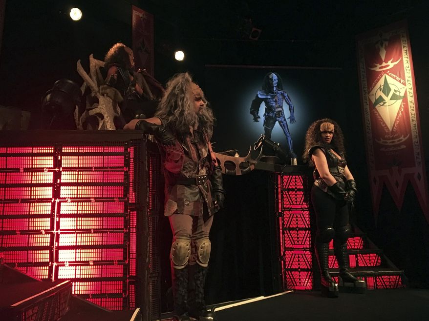 In this photo taken in Stockholm on Saturday, Feb. 3 2018, 'Klingon ambassadors' hold a presentation of Klingon culture. A theater in Stockholm is playing host to a Klingon delegation seeking to promote tourism to Qo'nos (pronounced "Kronos"), the home planet of the ruthless yet honorable race of warriors from the cult TV franchise "Star Trek." (AP Photo/David Keyton)