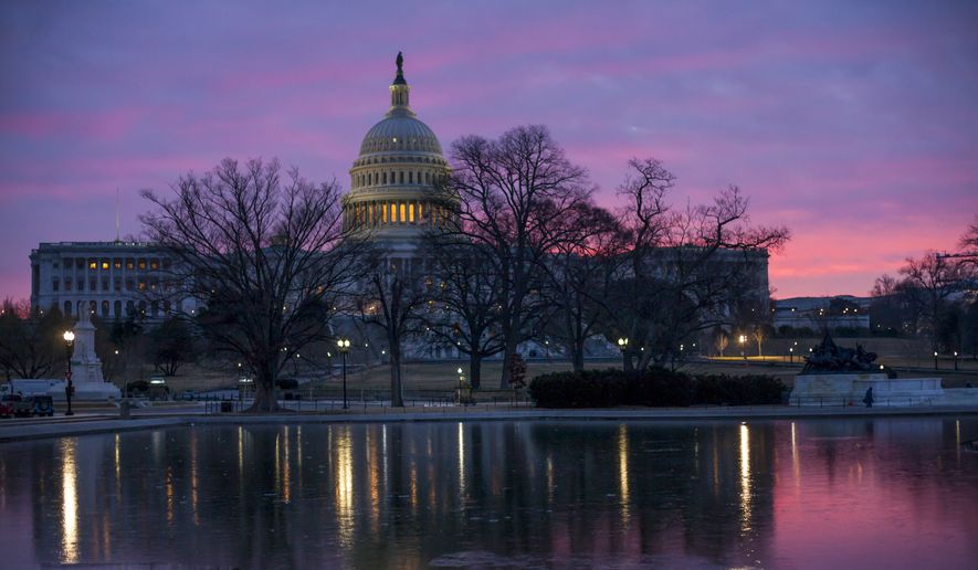Dawn breaks over the Capitol in Washington, Tuesday, Feb. 6, 2018, as House GOP leaders are proposing to keep the government open for another six weeks by adding a year&#x27;s worth of Pentagon funding to a stopgap spending bill. But Senate Democratic leader Chuck Schumer says that approach, fully funding the Defense Department but only providing temporary money for the rest of the government, won&#x27;t go anywhere. (AP Photo/J. Scott Applewhite)