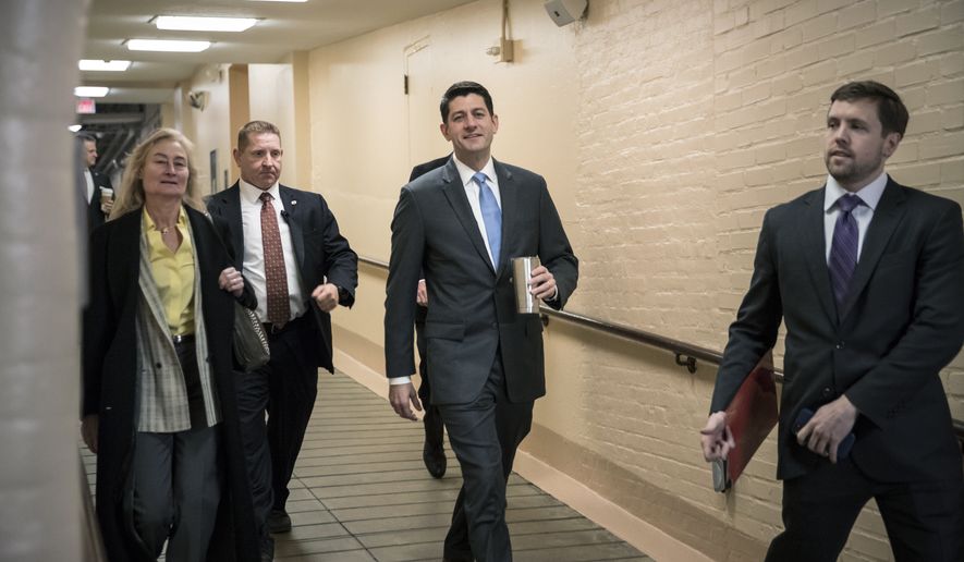 House Speaker Paul Ryan, R-Wis., center, walks to a Republican strategy conference at the Capitol as House GOP leaders are proposing to keep the government open for another six weeks by adding a year&#39;s worth of Pentagon funding to a stopgap spending bill, in Washington, Tuesday, Feb. 6, 2018. (AP Photo/J. Scott Applewhite)