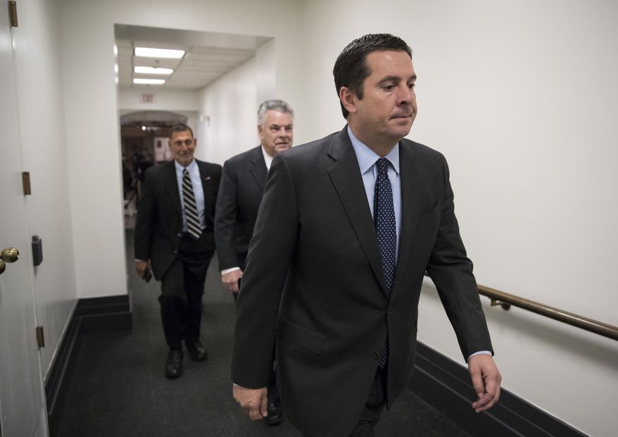 House Intelligence Committee Chairman Devin Nunes, R-Calif., a close ally of President Donald Trump who has become a fierce critic of the FBI and the Justice Department, strides to a GOP conference followed by Rep. Peter King, R-N.Y., also a member of the Intelligence Committee, at the Capitol in Washington, Tuesday, Feb. 6, 2018. Trump last week declassified a document written by the committee&#39;s Republican majority that criticized methods the FBI used to obtain a surveillance warrant on a onetime Trump campaign associate. Trump said the GOP memo showed the FBI and Justice Department conspired against him in the Russia probe. (AP Photo/J. Scott Applewhite)