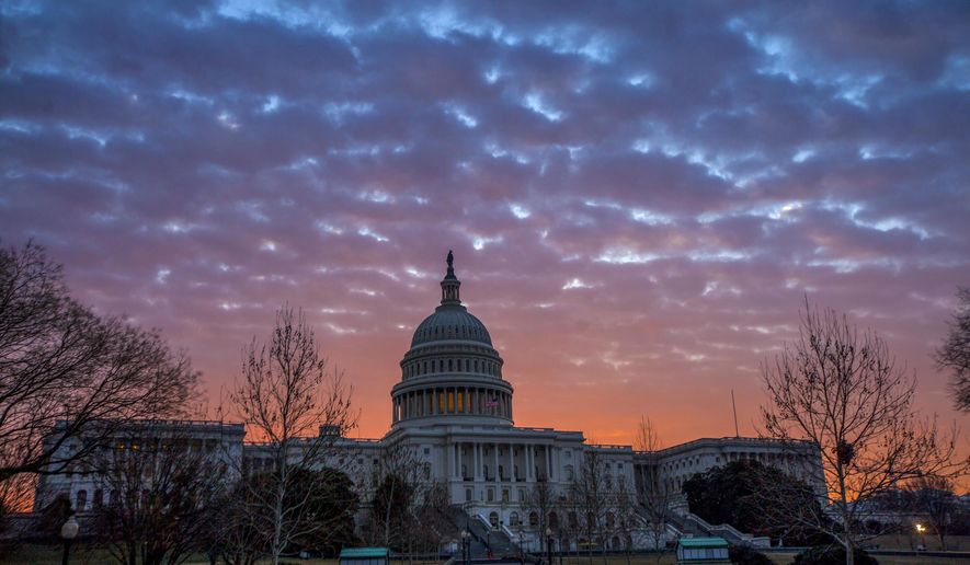 Dawn breaks over the Capitol in Washington, Tuesday, Feb. 6, 2018. (AP Photo/J. Scott Applewhite)